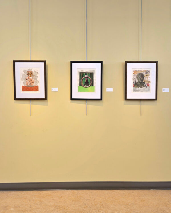 Artist Karen Koch standing next to her collage titled Stuck, which won an award at the Ohio Collage Society exhibit.